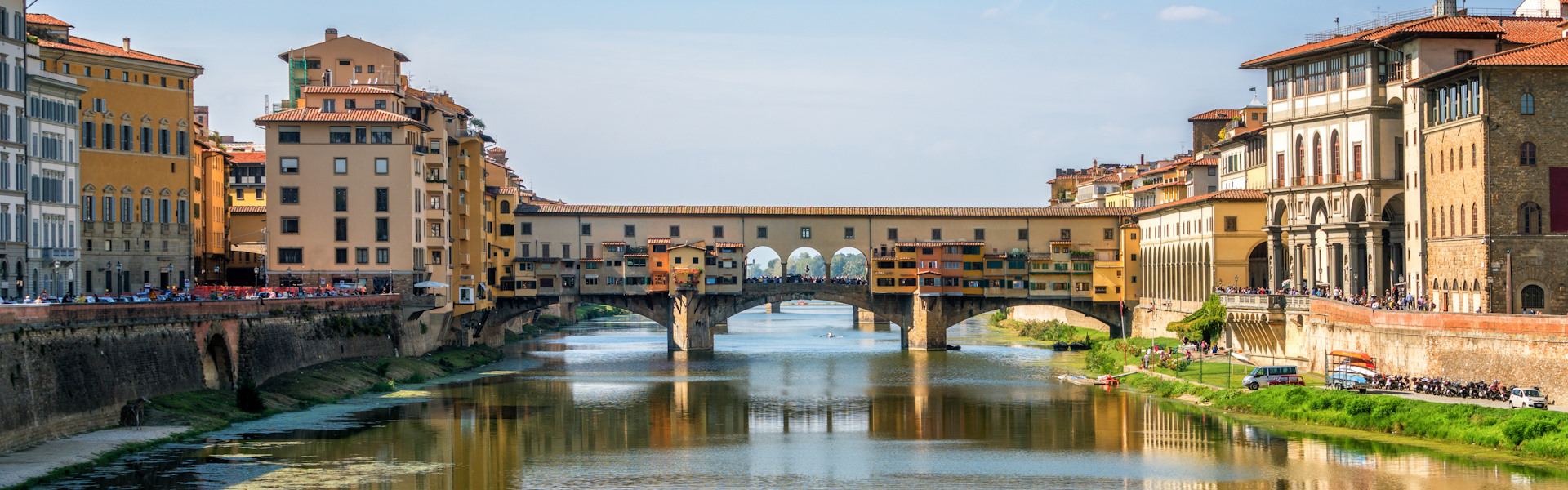 Florence Ponte Vecchio Bridge and City Skyline in Italy. Florence is capital city of the Tuscany region of central Italy. Florence was center of Italy medieval trade and wealthiest cities of past era.